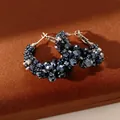 Elegant silver needle hoop earrings with dark faceted glass beads on brown velvet - Silver / Small / Blue