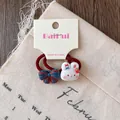 Detail of red elastic hair tie with cute white bunny and striped bow on display card - Rabbit Bowknot