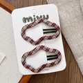 Detail of red and white checkered cloud-shaped BB hair clips on a display card - Red White Plaid Cloud