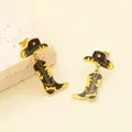 Close-up of stainless steel cowboy hat and boot earrings with yellow enamel detail. - Black Yellow Enamel Hat Boot Style (KE121855-SXSJ)