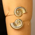 Detailed view of golden conch shell adjustable arm cuff for summer beach vacation style - Conch / KC Gold