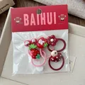 Detailed set of red cartoon hair ties with resin strawberry and cherry motifs for girls - Polka Dot Mushroom Style