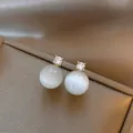 Elegant stud earrings with white round cat-eye stone and sparkling zircon detail - Round Clear Style / Gold