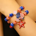 Patriotic multilayer bracelet set featuring American flag shell and rhinestone starfish charms. - Shell Starfish Stacked Style (20 Stacked)