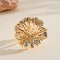 Detailed view of a golden metallic wrinkled flower ring with intricate petal textures - Ring / Gold