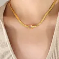 Gold flat blade chain necklace with a rectangular clear zircon pendant on model - White Zirconia Gold Necklace (P1325) / 39+5cm