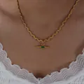 Elegant gold twisted rope chain necklace with a rectangular emerald green gemstone - Gold Tone Green Glass Style