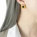 French retro hammered gold stud earrings with square black gemstone on female model - Gold Black Glass Earrings