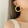 Retro style chunky gold-plated twisted hoop earrings for women in polished finish - Gold