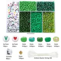 DIY bead set with green seed beads, letter beads, and elastic cord in a storage box - 3mm Seed Beads And Letter Beads (3500 Beads/Box) / Green Series