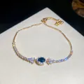 Luxuriöses elegantes goldfarbenes Armband mit blauem Mittelstein und glänzenden Zirkonen - Tiefblauer Halo Verstellbarer Stil (39#)