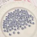 Weiße Acrylperlen mit schwarzen Stern- und Mondsymbolen für DIY-Schmuckherstellung - 7x4mm (50 Stück/Packung) / Weiß mit schwarzen Buchstaben