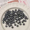 Flat round black acrylic beads with white moon and star patterns for DIY jewelry - Black with White Letters