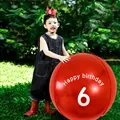 Detail of a large red 6th birthday balloon with crown accessory for outdoor party decor - Age 6 Theme Set / Red