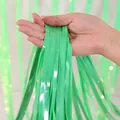 Detail of light green foil fringe curtain with high-gloss finish for party backdrop - Macaron Green
