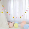 Detail of pink, white and gold glittery circle paper garland hanging on a play tent - Circle Gold White Pink
