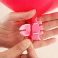 Pink ergonomic balloon tying tool for wedding and party decorations, functional demo - Balloon Tying Tool (Random Color)