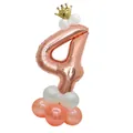 Detail of rose gold number 4 balloon with gold crown and pink latex base decor - Number 4 Rose Gold Column
