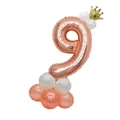Detail of rose gold number 9 balloon with gold crown and latex base for birthday party decor - Number 9 Rose Gold Column