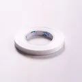 Single roll of pure white decorative ribbon for wedding and party decorations - White