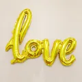 Detailed view of the gold foil LOVE letter balloon for wedding and party decorations - Gold