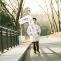 32 inch white number 1 balloon with Happy Birthday print held by a child in the park - Number 7