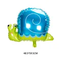 Detail view of snail foil balloon with blue shell and green body for party decor - Snail