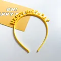 Macro detail of yellow Happy Birthday headband with vibrant 3D letters for party - Yellow