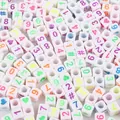 Macro view of white acrylic cube beads with colorful numbers and symbols for DIY jewelry - Number Beads / 6x6mm Hole 4mm 100 Pieces/Pack / White With Neon Numbers