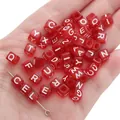 Handheld display of red square acrylic alphabet beads for DIY jewelry making - Alphabet Beads / 6x6mm Hole 4mm 100 Pieces/Pack / Transparent Red with White Letters