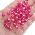Translucent rose red acrylic alphabet cube beads for DIY jewelry held in a palm - Alphabet Beads / 6x6mm Hole 4mm 100 Pieces/Pack / Transparent Rose Red With White Letters