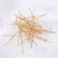 Macro view of bright 14K gold-plated flat head pins for DIY jewelry making - 0.7x20mm (50 Pcs/Pack) / 18K Gold