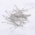 Close-up of bulk silver-plated 9-shape eye pins for DIY handmade jewelry and beaded crafts - 0.7x20mm (50 Pcs/Pack) / White Gold