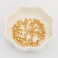 Golden round CCB spacer beads for DIY jewelry making in a white ceramic petal dish - 4mm (300 Pieces/Pack) / Gold