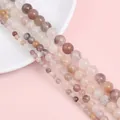 Macro shot of mixed natural stone beads showing smooth texture and various sizes - Violet / 4mm