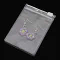 Handgefertigte lila-gelbe Blumenohrringe in einem klaren PVC-Aufbewahrungsbeutel - 10 Stück/Packung (7x10cm)