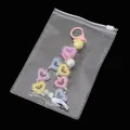 Bunter Herzanhänger aus Harz mit Perlen in einem transparenten PVC-Druckverschlussbeutel - 10 Stück/Packung (11x16cm)