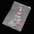 Colorful heart-shaped acrylic bead pendants in a clear PVC self-sealing storage bag - 10 Pieces/Pack (13x19cm)