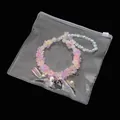 Floral beaded bracelet set with colorful resin charms in a clear PVC storage pouch - 10 Pieces/Pack (15x15cm)