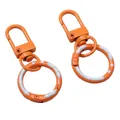 Schlüsselanhänger aus Legierung in Orange mit Federring und blauem Punktemuster - Gesamtlänge ca. 52 mm Schnallengröße 12 x 32 mm Federverschluss-Außendurchmesser 24 mm Dicke ca. 3 mm / 1 Stück / Orange