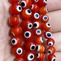Red evil eye glass beads for DIY jewelry making held in hand for size display - 6mm-Medium Style (Approx. 65 Pcs) / Red