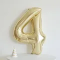 Champagne gold 40-inch number 4 foil balloon with decorative mini party hat - 40 Inch White Gold Number 4