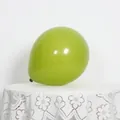 Detail of a 10-inch matte olive green latex balloon for elegant party backdrops - Avocado Green