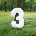 White 32-inch foil number 3 balloon displayed against a natural forest background - Number 3