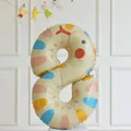 Number 8 cream balloon with colorful polka dots on a standing base for kids parties - Snake Print Number Eight