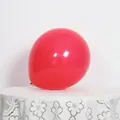 Classic 10-inch red matte latex balloon placed on a white lace tablecloth for parties - Matte Red