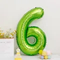 Detailed view of a large number 6 fruit green foil balloon for birthday party decorations - Number 6