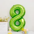 Detail of large number 8 lime green foil balloon for birthday party decorations - Number 8