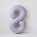 Detail view of a matte pastel purple number 8 foil balloon for birthday party decorations - Number 8