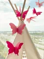 Close-up of 3D paper butterflies in pink and magenta on a decorative white indoor tent - Gradient Pink